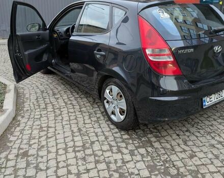 Черный Хендай i30, объемом двигателя 1.4 л и пробегом 174 тыс. км за 4800 $, фото 3 на Automoto.ua
