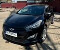 Черный Хендай i30, объемом двигателя 1.4 л и пробегом 220 тыс. км за 7300 $, фото 1 на Automoto.ua