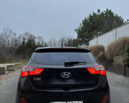 Черный Хендай i30, объемом двигателя 1.4 л и пробегом 200 тыс. км за 8500 $, фото 6 на Automoto.ua