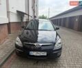 Черный Хендай i30, объемом двигателя 1.58 л и пробегом 100 тыс. км за 7300 $, фото 1 на Automoto.ua