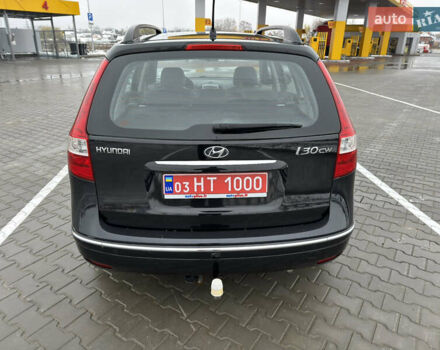 Черный Хендай i30, объемом двигателя 1.6 л и пробегом 169 тыс. км за 6150 $, фото 4 на Automoto.ua
