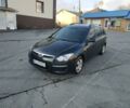 Чорний Хендай i30, об'ємом двигуна 1.4 л та пробігом 158 тис. км за 5450 $, фото 1 на Automoto.ua