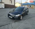 Черный Хендай i30, объемом двигателя 1.4 л и пробегом 158 тыс. км за 5600 $, фото 1 на Automoto.ua