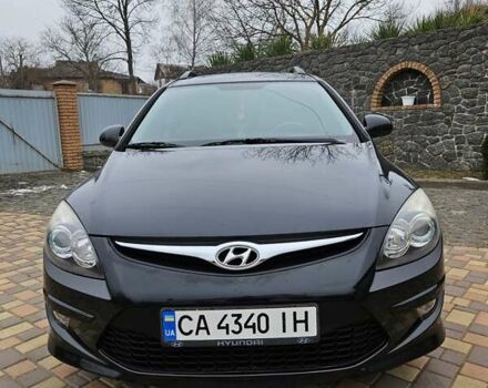 Черный Хендай i30, объемом двигателя 1.4 л и пробегом 154 тыс. км за 6700 $, фото 1 на Automoto.ua