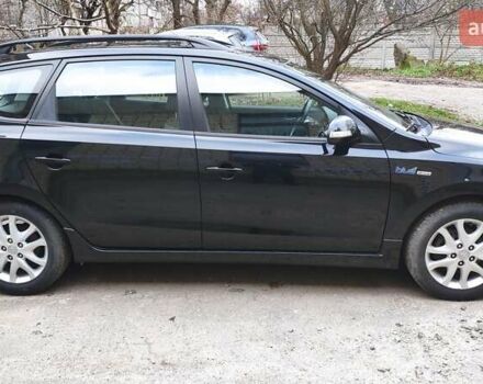 Черный Хендай i30, объемом двигателя 1.4 л и пробегом 275 тыс. км за 6000 $, фото 6 на Automoto.ua