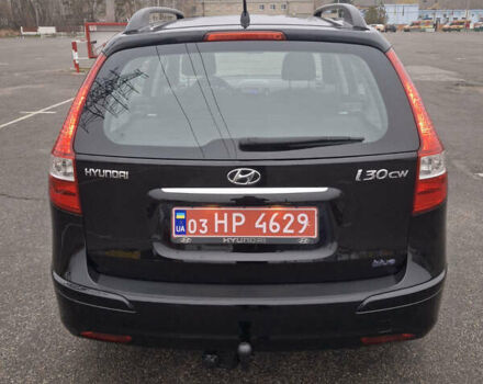 Чорний Хендай i30, об'ємом двигуна 1.4 л та пробігом 209 тис. км за 6850 $, фото 3 на Automoto.ua