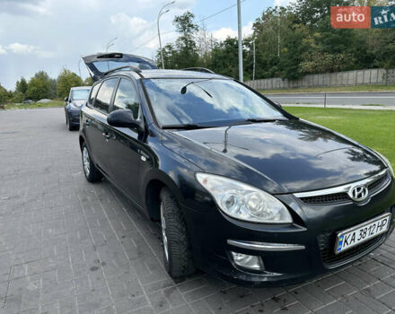 Черный Хендай i30, объемом двигателя 1.58 л и пробегом 257 тыс. км за 5650 $, фото 1 на Automoto.ua