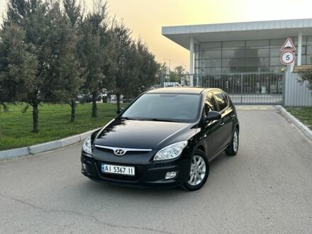 Черный Хендай i30, объемом двигателя 1.6 л и пробегом 140 тыс. км за 6900 $, фото 1 на Automoto.ua