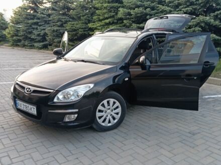 Чорний Хендай i30, об'ємом двигуна 1.6 л та пробігом 218 тис. км за 5450 $, фото 1 на Automoto.ua