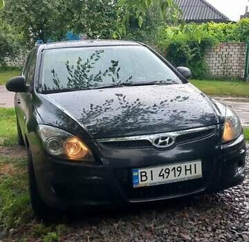Черный Хендай i30, объемом двигателя 1.4 л и пробегом 275 тыс. км за 4700 $, фото 1 на Automoto.ua
