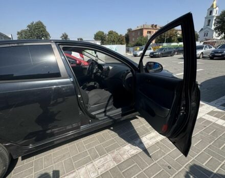 Черный Хендай i30, объемом двигателя 1.4 л и пробегом 215 тыс. км за 6100 $, фото 1 на Automoto.ua