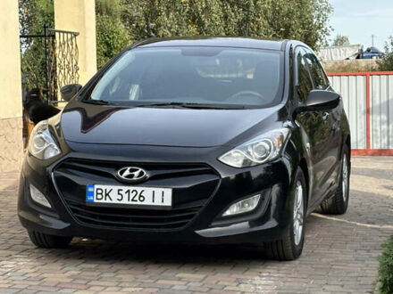 Черный Хендай i30, объемом двигателя 1.4 л и пробегом 259 тыс. км за 6600 $, фото 1 на Automoto.ua