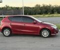 Червоний Хендай i30, об'ємом двигуна 1.4 л та пробігом 261 тис. км за 4450 $, фото 2 на Automoto.ua