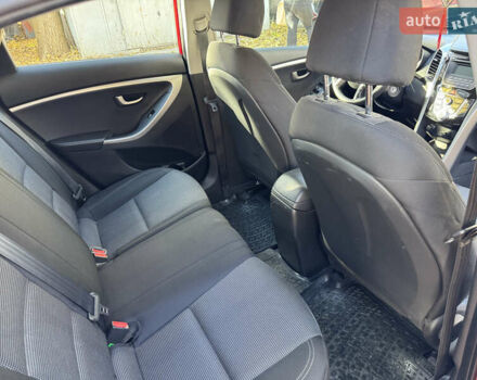 Червоний Хендай i30, об'ємом двигуна 1.4 л та пробігом 70 тис. км за 12500 $, фото 9 на Automoto.ua