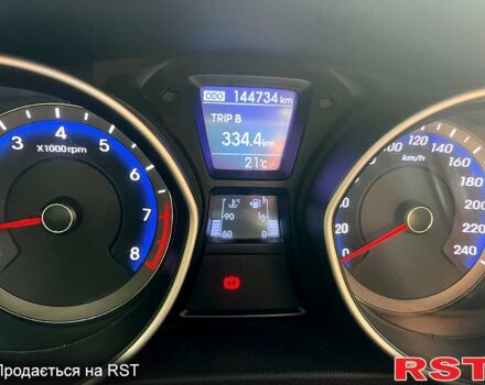 Червоний Хендай i30, об'ємом двигуна 1.4 л та пробігом 148 тис. км за 7400 $, фото 8 на Automoto.ua