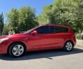 Красный Хендай i30, объемом двигателя 1.4 л и пробегом 300 тыс. км за 5900 $, фото 1 на Automoto.ua