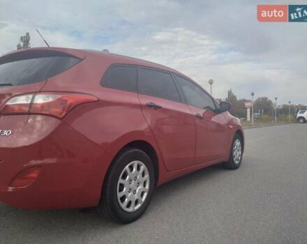 Красный Хендай i30, объемом двигателя 1.4 л и пробегом 295 тыс. км за 7950 $, фото 7 на Automoto.ua