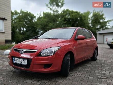 Красный Хендай i30, объемом двигателя 1.4 л и пробегом 194 тыс. км за 5200 $, фото 1 на Automoto.ua