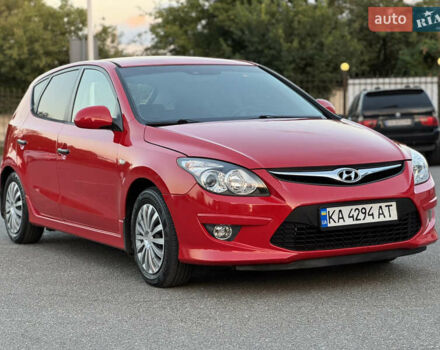 Красный Хендай i30, объемом двигателя 1.59 л и пробегом 165 тыс. км за 6950 $, фото 1 на Automoto.ua