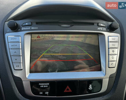 Чорний Хендай іх35, об'ємом двигуна 2 л та пробігом 225 тис. км за 12999 $, фото 28 на Automoto.ua