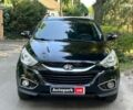 Чорний Хендай іх35, об'ємом двигуна 2 л та пробігом 195 тис. км за 13790 $, фото 1 на Automoto.ua