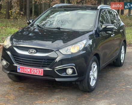 Чорний Хендай іх35, об'ємом двигуна 2 л та пробігом 240 тис. км за 12500 $, фото 1 на Automoto.ua