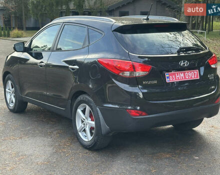 Чорний Хендай іх35, об'ємом двигуна 2 л та пробігом 240 тис. км за 12500 $, фото 6 на Automoto.ua