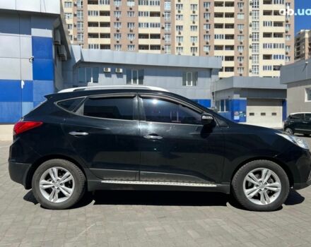 Чорний Хендай іх35, об'ємом двигуна 2 л та пробігом 218 тис. км за 12990 $, фото 5 на Automoto.ua
