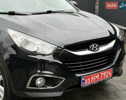 Чорний Хендай іх35, об'ємом двигуна 2 л та пробігом 206 тис. км за 13099 $, фото 4 на Automoto.ua