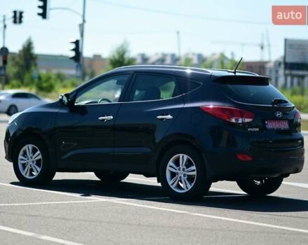 Чорний Хендай іх35, об'ємом двигуна 2 л та пробігом 226 тис. км за 10990 $, фото 6 на Automoto.ua