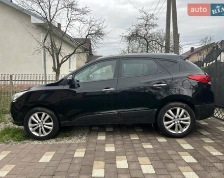 Чорний Хендай іх35, об'ємом двигуна 2 л та пробігом 181 тис. км за 12200 $, фото 1 на Automoto.ua