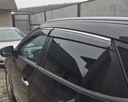 Чорний Хендай іх35, об'ємом двигуна 2 л та пробігом 255 тис. км за 12750 $, фото 1 на Automoto.ua