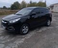 Черный Хендай их35, объемом двигателя 1.7 л и пробегом 215 тыс. км за 13000 $, фото 1 на Automoto.ua