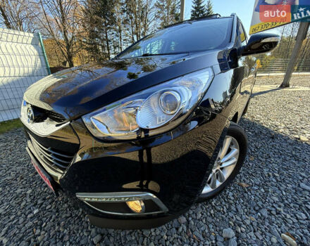 Чорний Хендай іх35, об'ємом двигуна 2 л та пробігом 153 тис. км за 13999 $, фото 5 на Automoto.ua