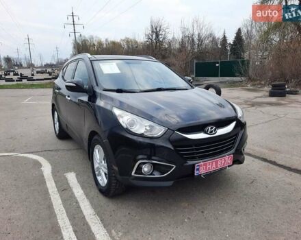 Чорний Хендай іх35, об'ємом двигуна 2 л та пробігом 211 тис. км за 12700 $, фото 1 на Automoto.ua