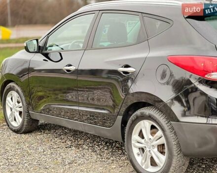 Чорний Хендай іх35, об'ємом двигуна 2 л та пробігом 195 тис. км за 12800 $, фото 19 на Automoto.ua