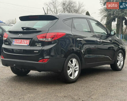 Чорний Хендай іх35, об'ємом двигуна 2 л та пробігом 218 тис. км за 12999 $, фото 6 на Automoto.ua