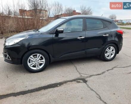 Чорний Хендай іх35, об'ємом двигуна 2 л та пробігом 211 тис. км за 12700 $, фото 9 на Automoto.ua