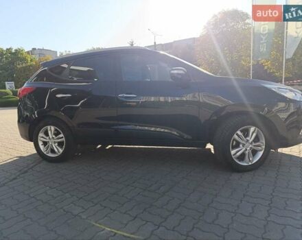 Чорний Хендай іх35, об'ємом двигуна 2 л та пробігом 237 тис. км за 12950 $, фото 1 на Automoto.ua