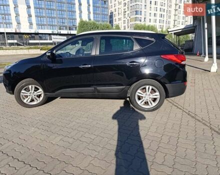 Чорний Хендай іх35, об'ємом двигуна 2 л та пробігом 237 тис. км за 12950 $, фото 3 на Automoto.ua