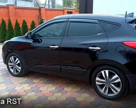 Чорний Хендай іх35, об'ємом двигуна 2 л та пробігом 167 тис. км за 13800 $, фото 1 на Automoto.ua