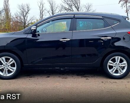 Чорний Хендай іх35, об'ємом двигуна 2 л та пробігом 169 тис. км за 14300 $, фото 3 на Automoto.ua