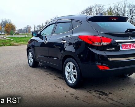 Чорний Хендай іх35, об'ємом двигуна 2 л та пробігом 169 тис. км за 14300 $, фото 6 на Automoto.ua