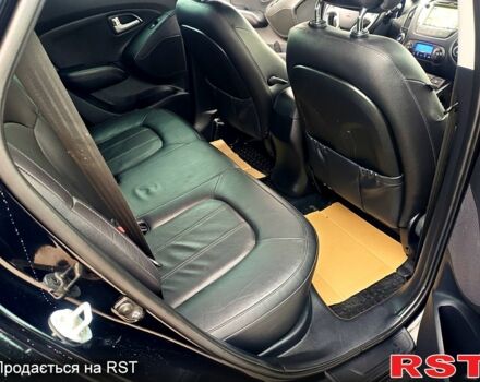 Чорний Хендай іх35, об'ємом двигуна 2 л та пробігом 203 тис. км за 13500 $, фото 2 на Automoto.ua