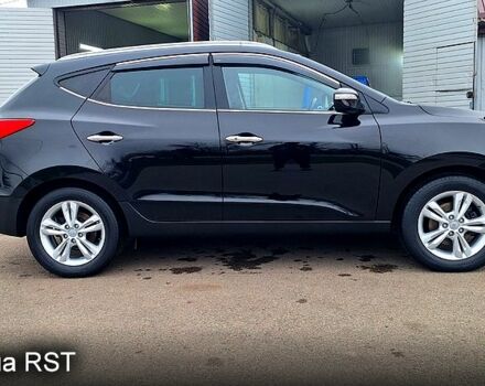 Чорний Хендай іх35, об'ємом двигуна 2 л та пробігом 169 тис. км за 14300 $, фото 4 на Automoto.ua