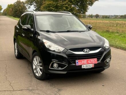 Чорний Хендай іх35, об'ємом двигуна 2 л та пробігом 233 тис. км за 13500 $, фото 1 на Automoto.ua