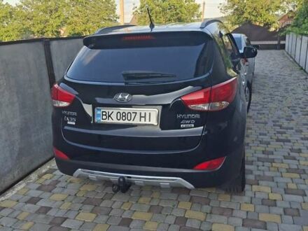 Чорний Хендай іх35, об'ємом двигуна 2 л та пробігом 280 тис. км за 12700 $, фото 1 на Automoto.ua