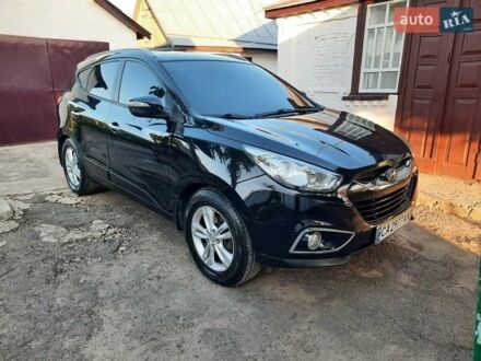 Чорний Хендай іх35, об'ємом двигуна 2 л та пробігом 209 тис. км за 11950 $, фото 1 на Automoto.ua