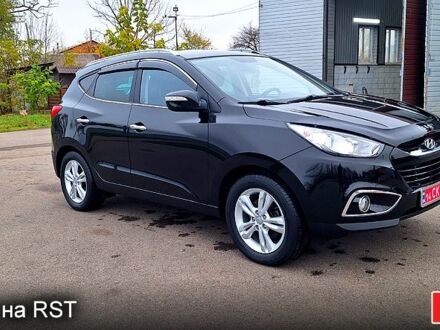 Чорний Хендай іх35, об'ємом двигуна 2 л та пробігом 169 тис. км за 14300 $, фото 1 на Automoto.ua