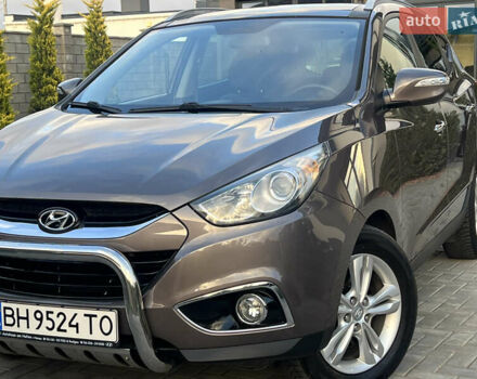 Коричневый Хендай их35, объемом двигателя 2 л и пробегом 136 тыс. км за 13999 $, фото 13 на Automoto.ua